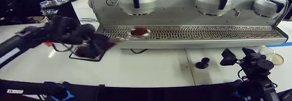Robot arms operating an espresso machine